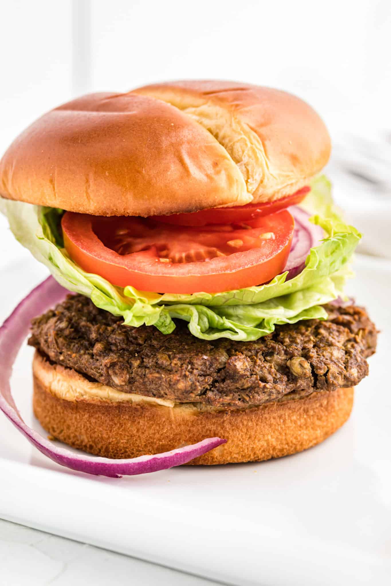 A gluten free lentil burger on a bun