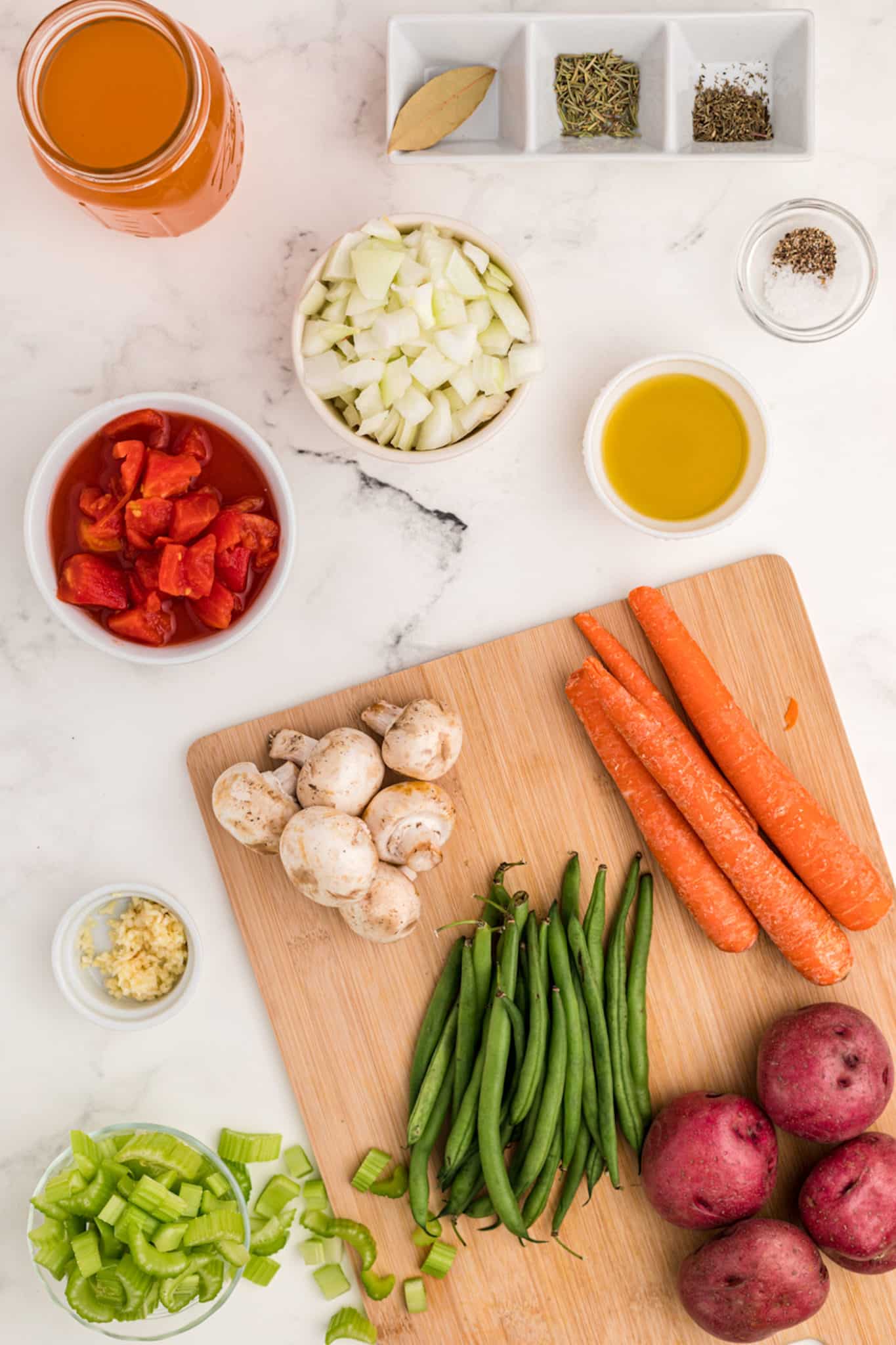 ingredients for instant pot vegetable stew laid out on table