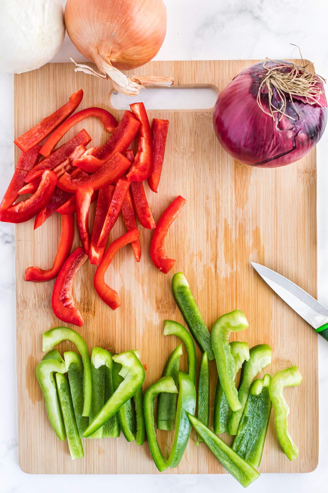 Sliced bell peppers on a cutting board