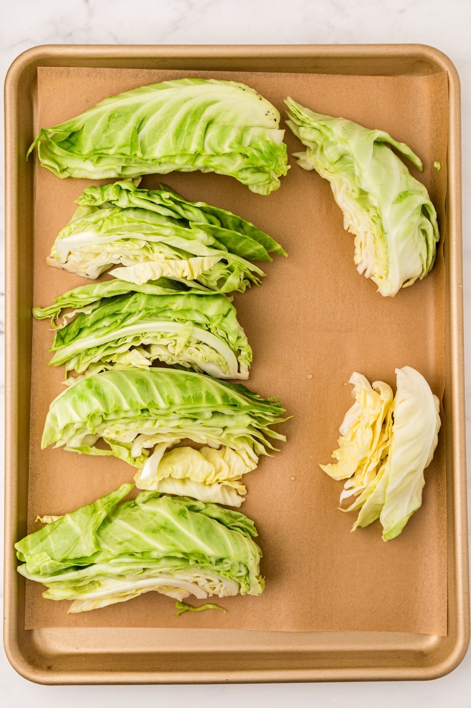 blanched cabbage on baking sheet ready to be frozen.