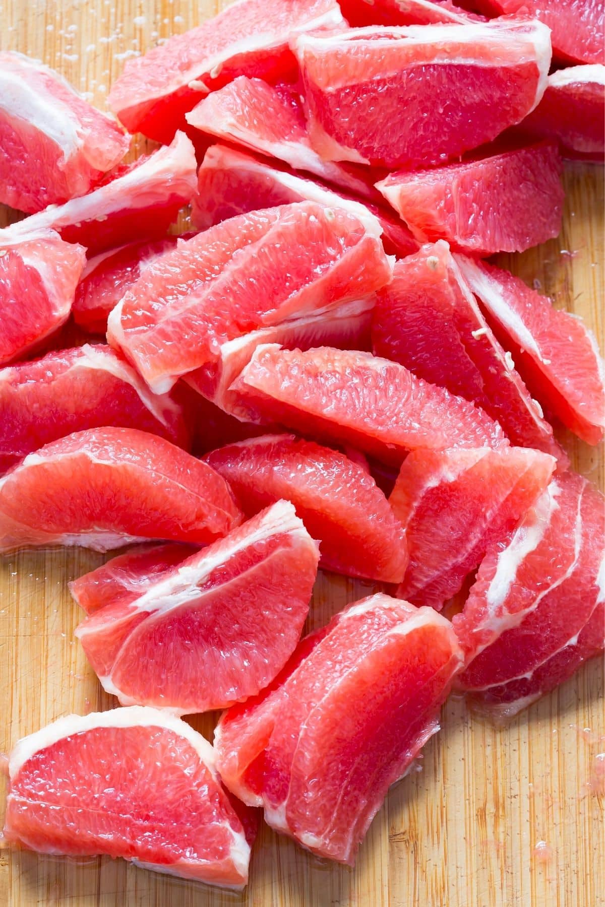 grapefruit sections on a cutting board