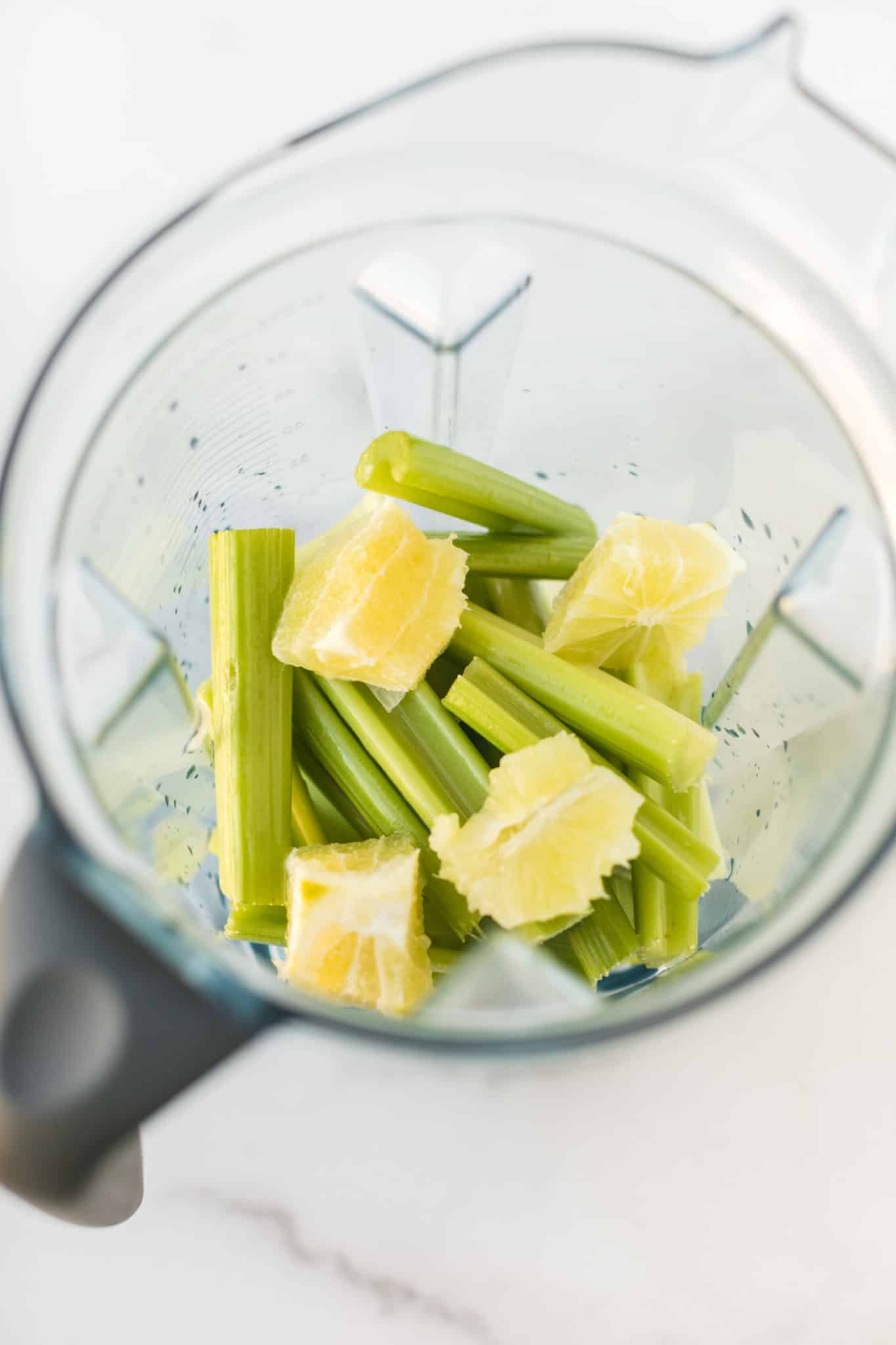 celery and ginger in a blender.