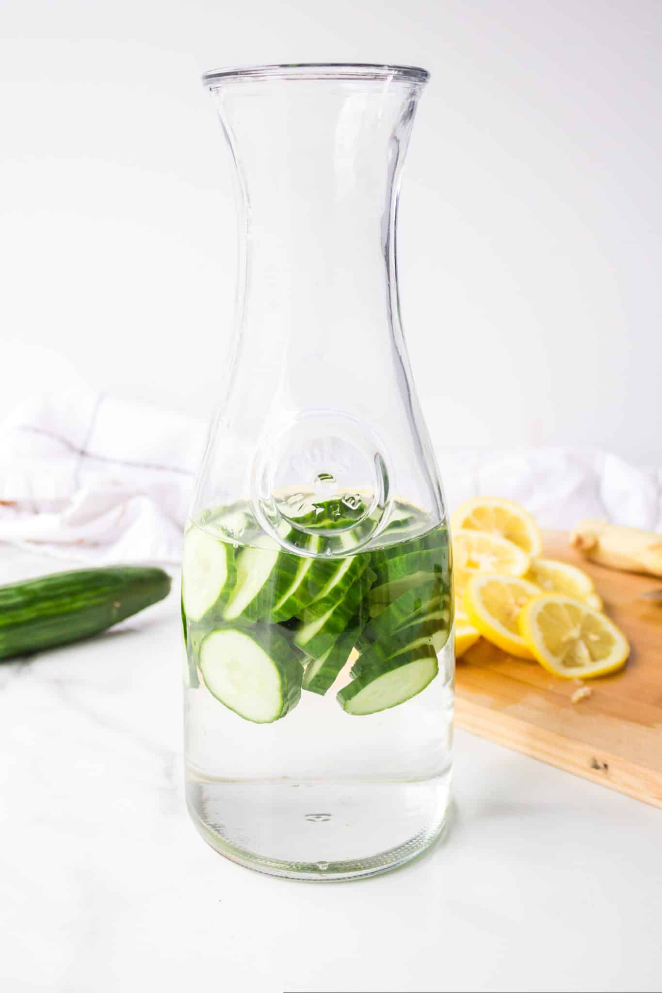 sliced cucumbers in water