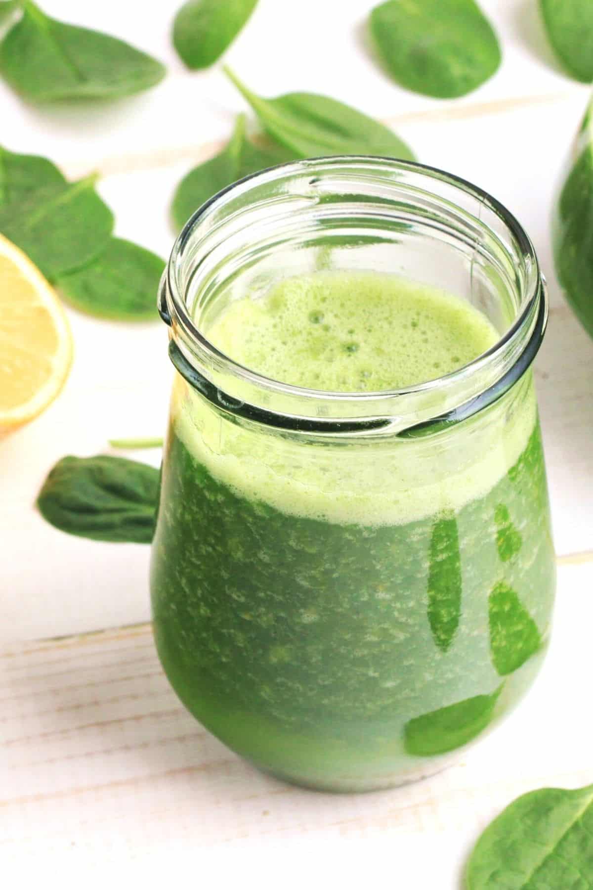 a glass of green juice.