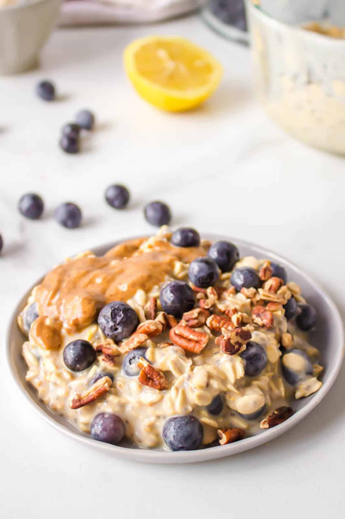 blueberry oatmeal served with nuts and nut butter.