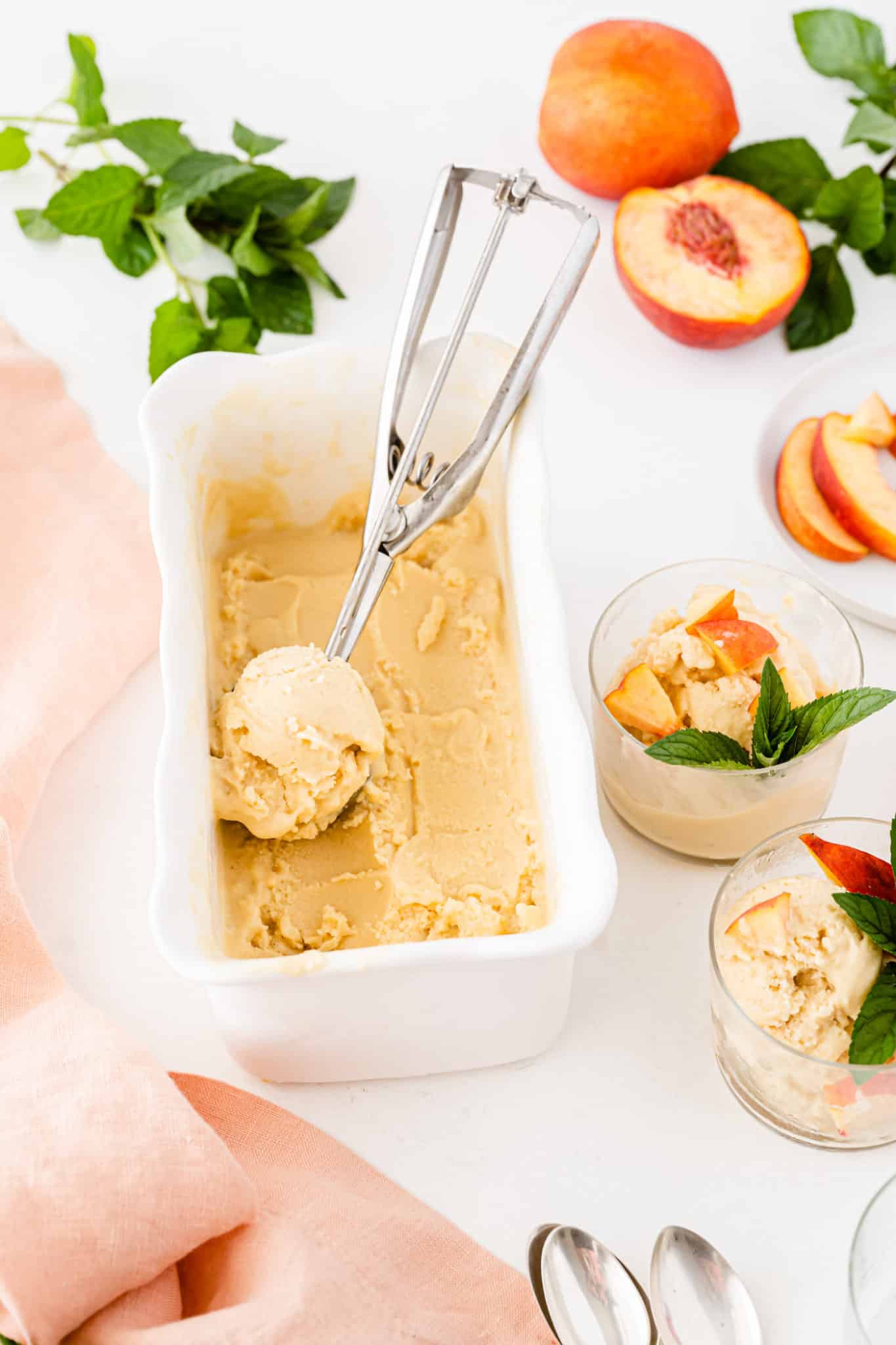 ice cream in a container with an ice cream scooper