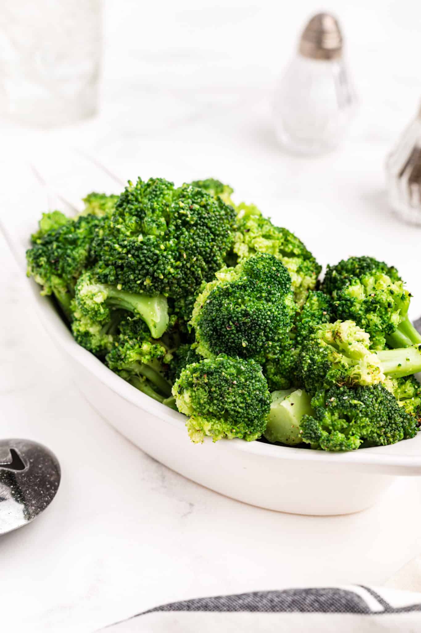 cooked air fryer frozen broccoli in a serving dish.