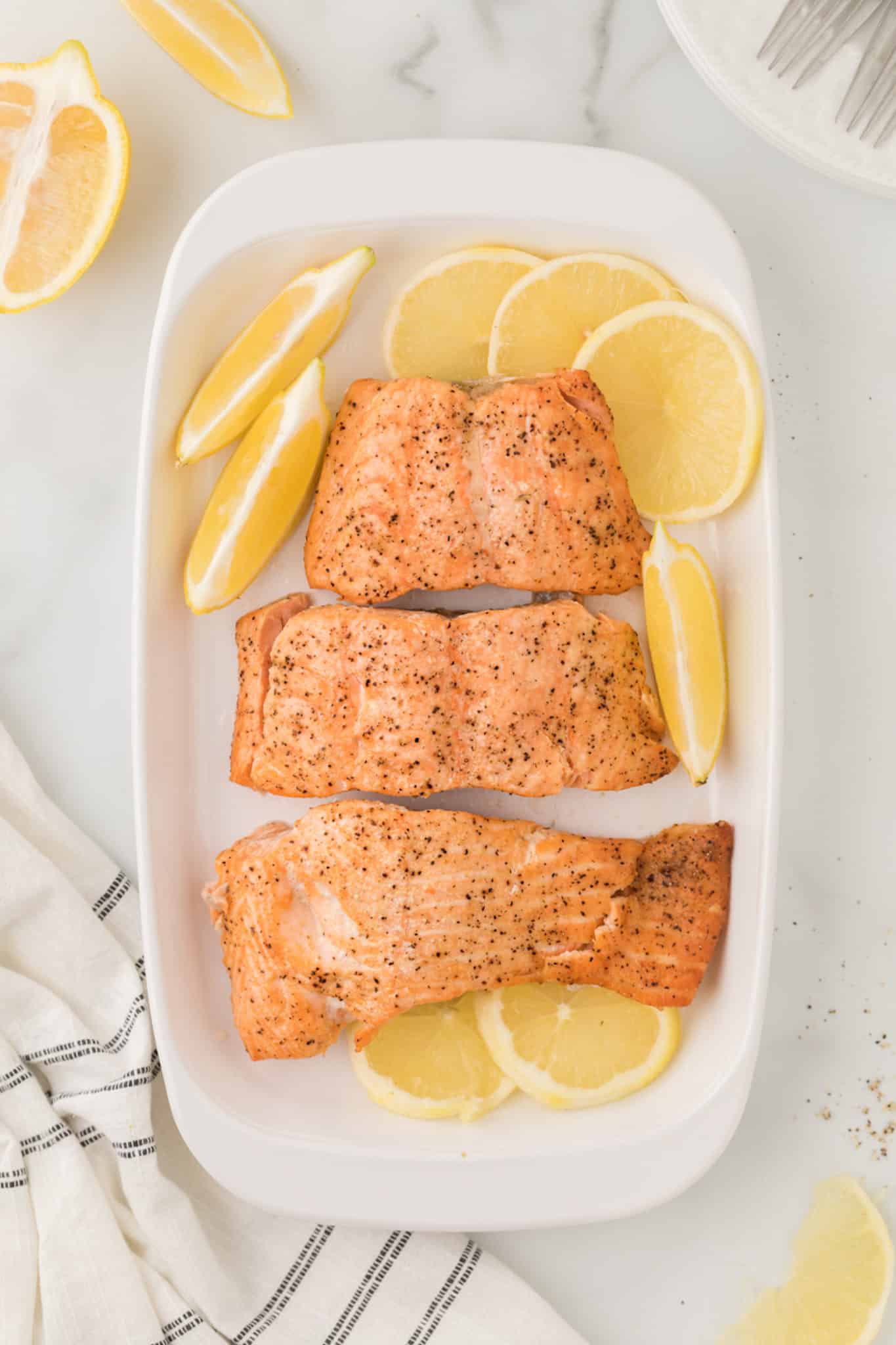 platter with salmon and lemons.