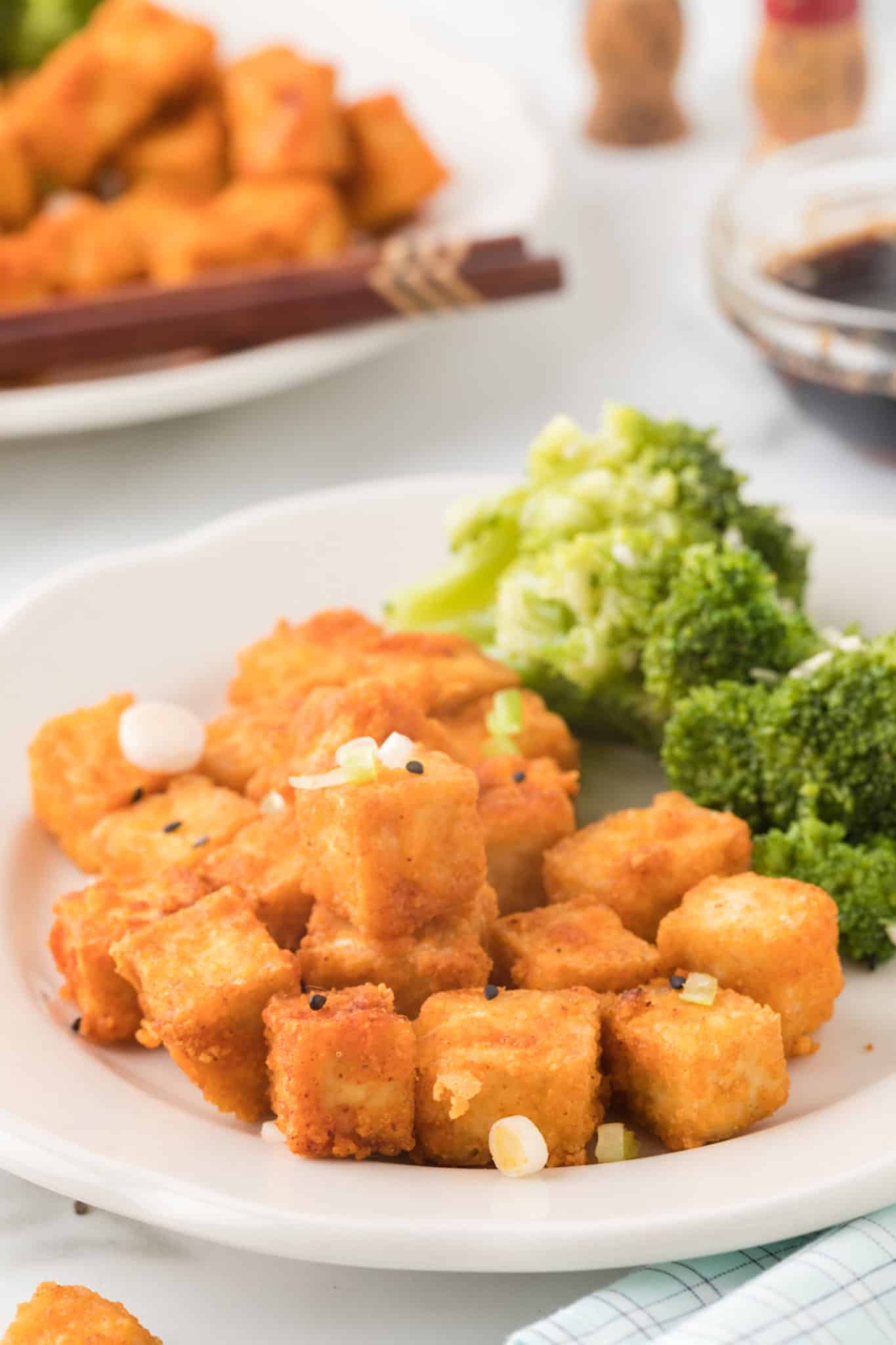 crispy tofu made in air fryer served with broccoli.