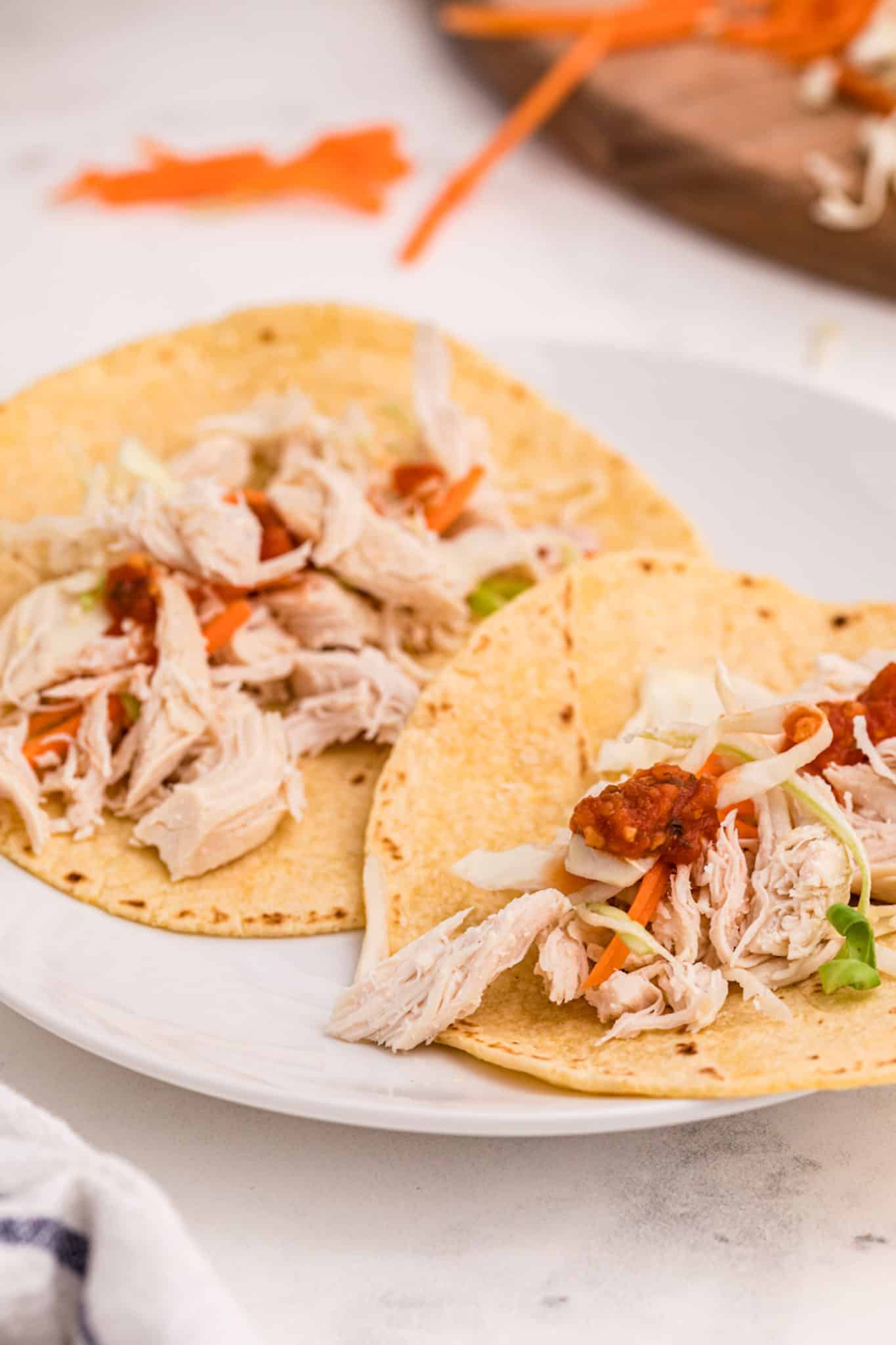 chicken tacos on a plate.