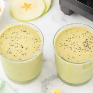 green apple smoothie in two glasses