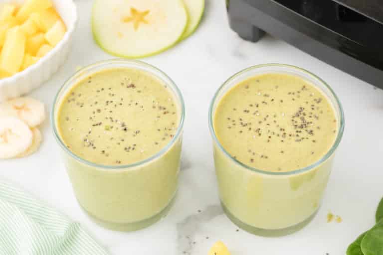 green apple smoothie in two glasses