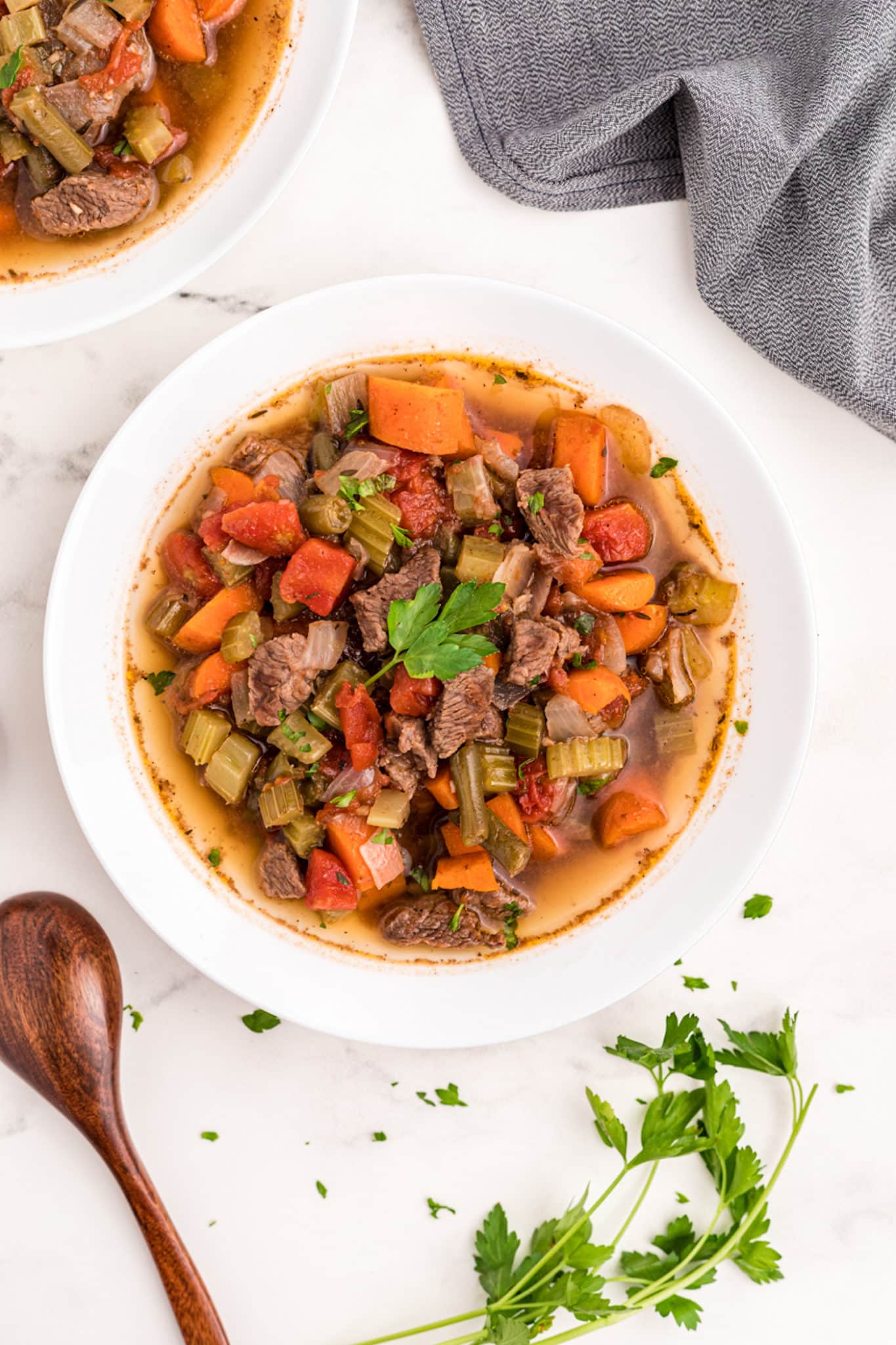 instant pot beef vegetable soup served in white bowl.