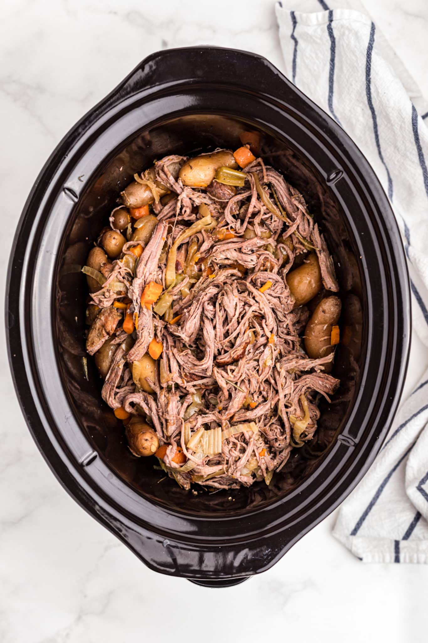 shredded tri tip with veggies in slow cooker