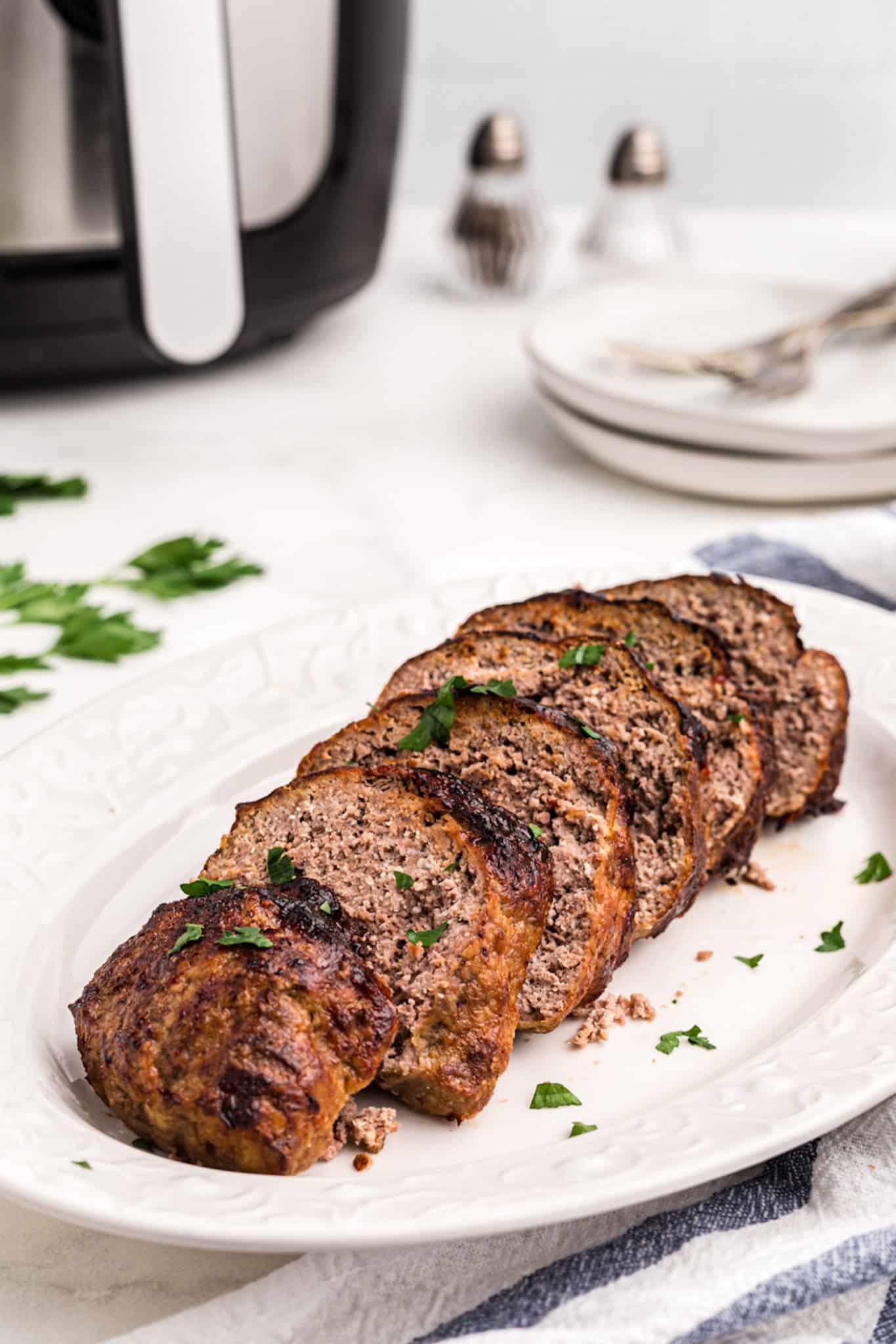 sliced keto air fryer meatloaf on a platter.