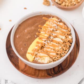 chocolate smoothie bowl with toppings.