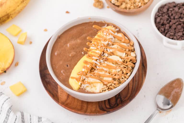 chocolate smoothie bowl with toppings.