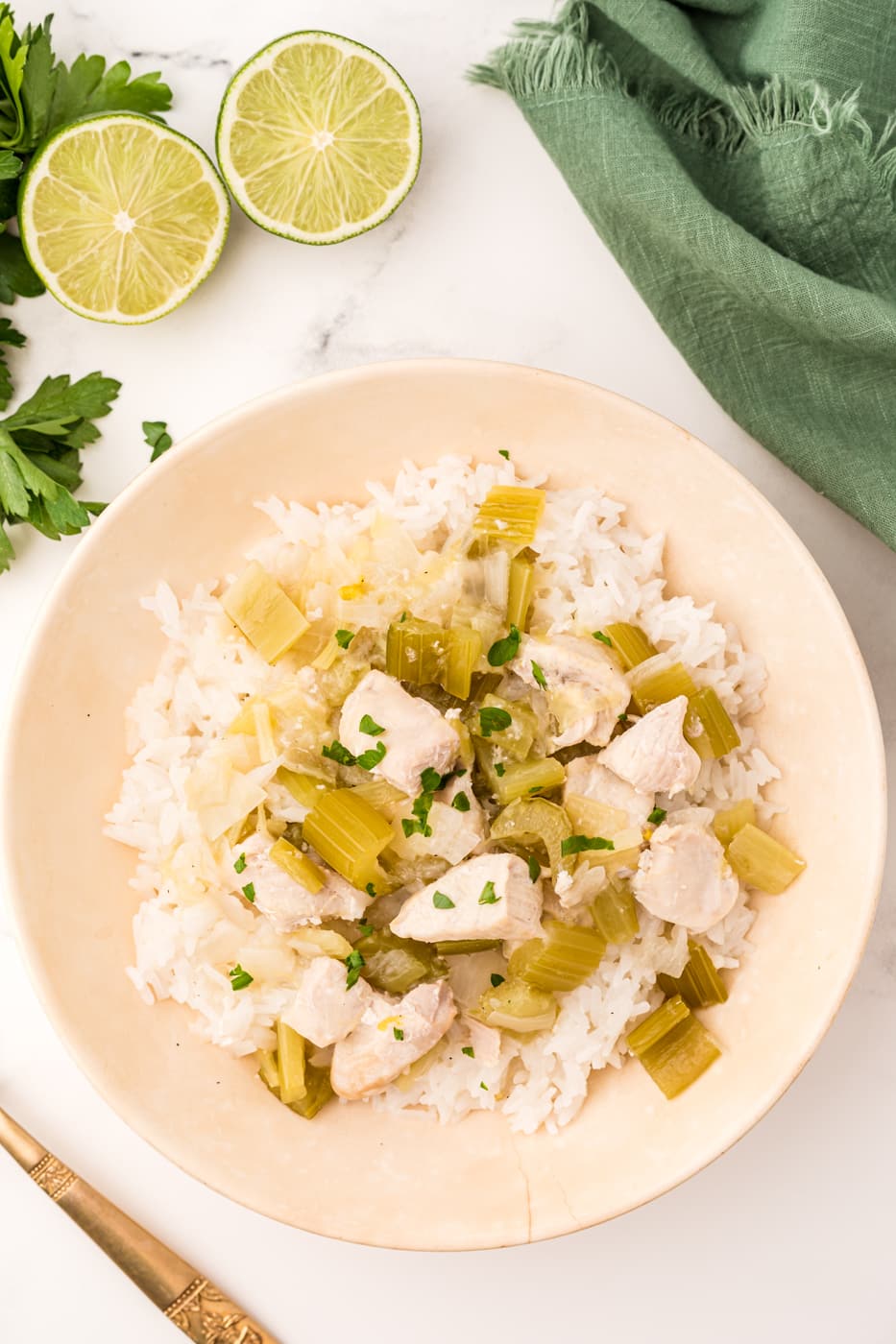 coconut chicken with rice served in a bowl.