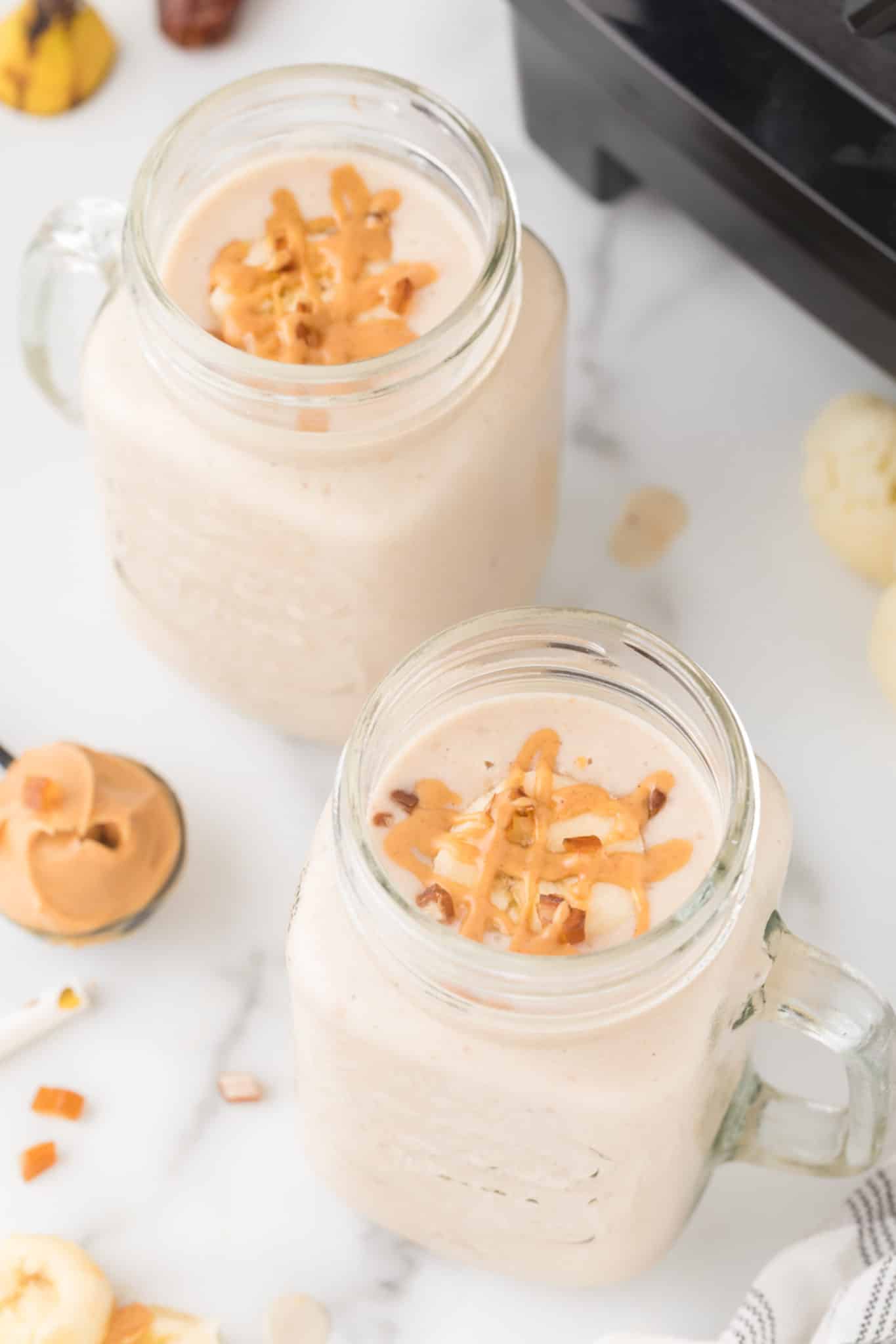 two glasses of peanut butter cauliflower smoothie