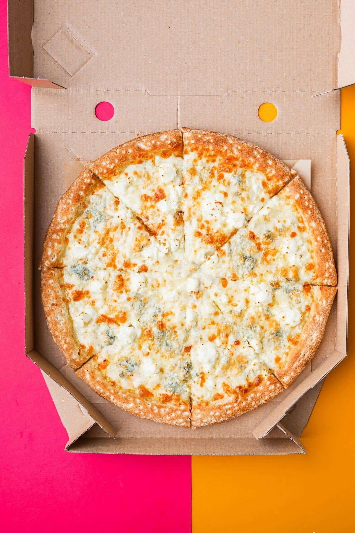pizza in a cardboard box.