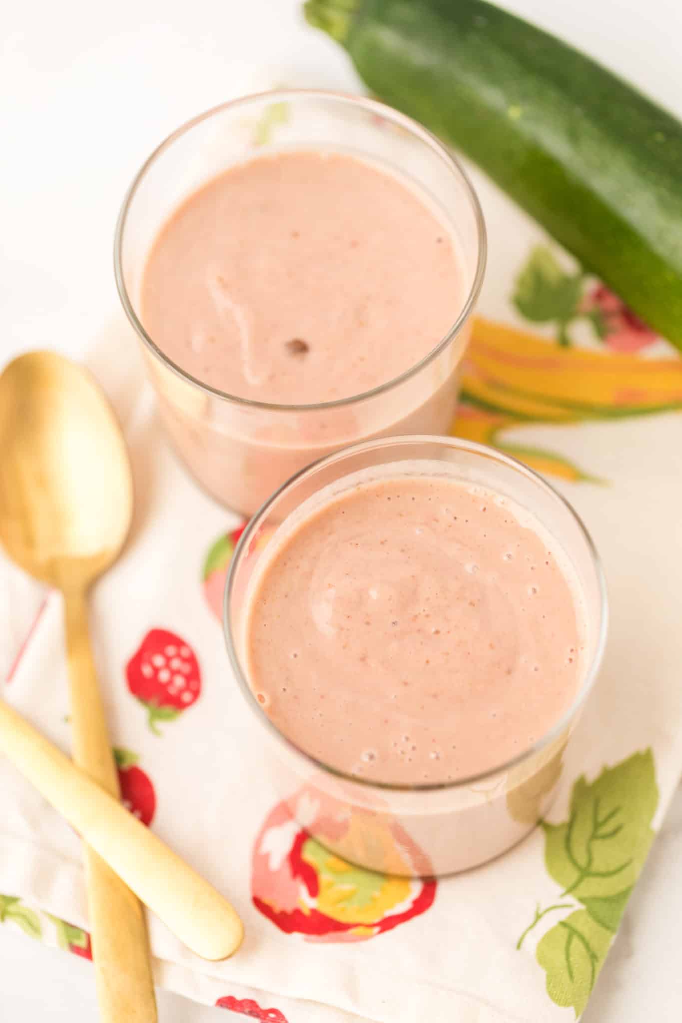 two glasses of strawberry zucchini smoothie