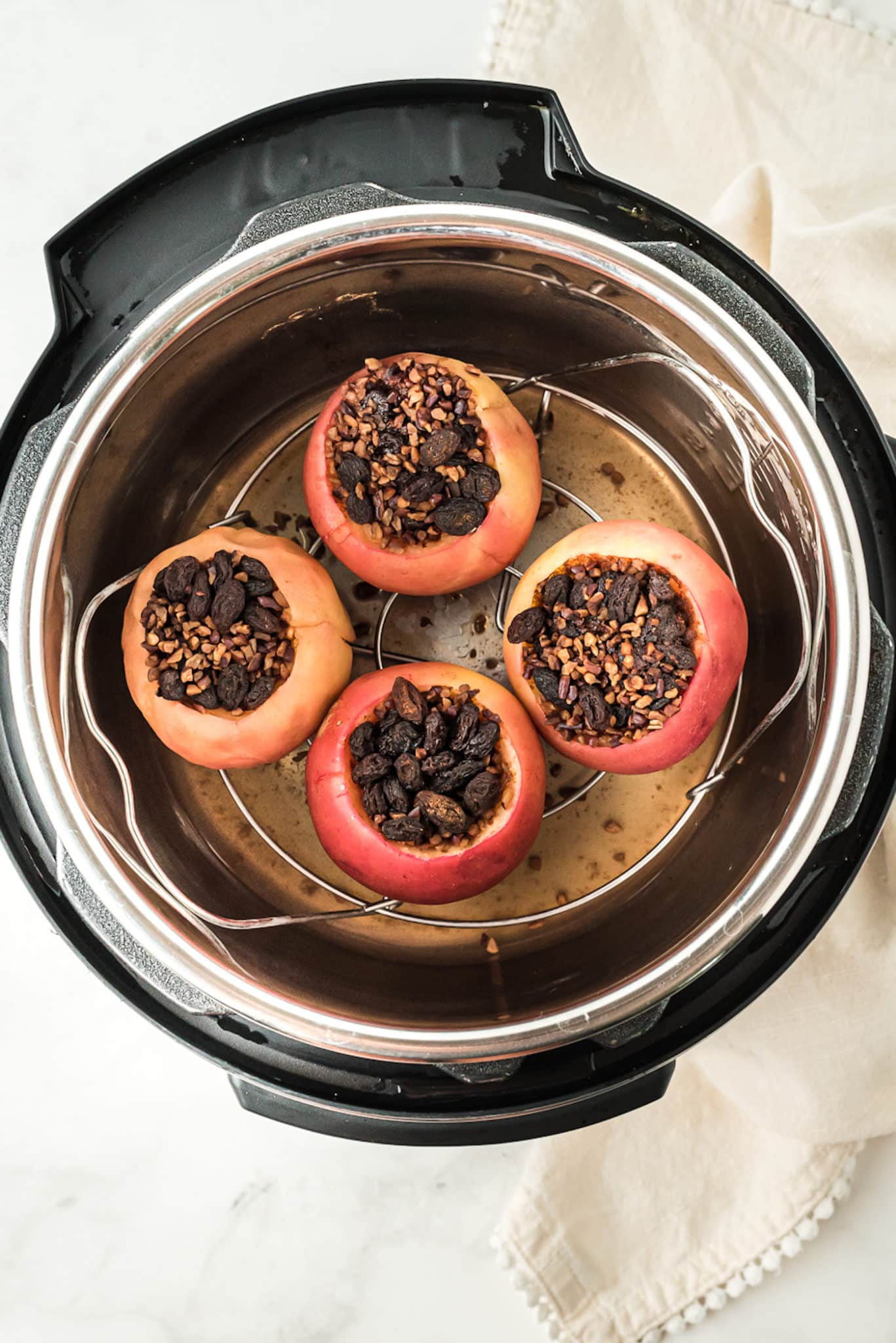 baked apples inside of the instant pot pressure cooker