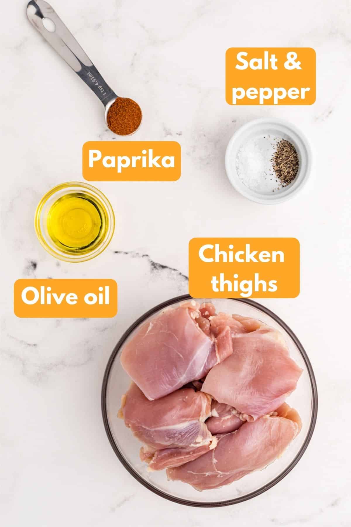 labeled photo with ingredients for paprika baked chicken thighs