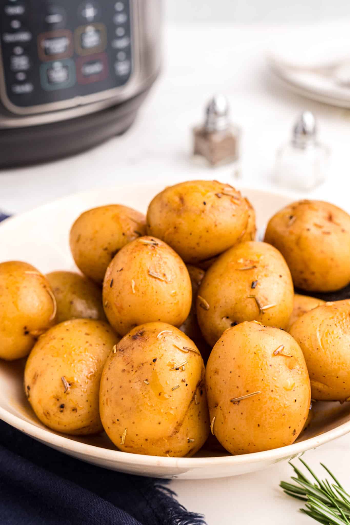 cooked instant pot baby potatoes on a plate.