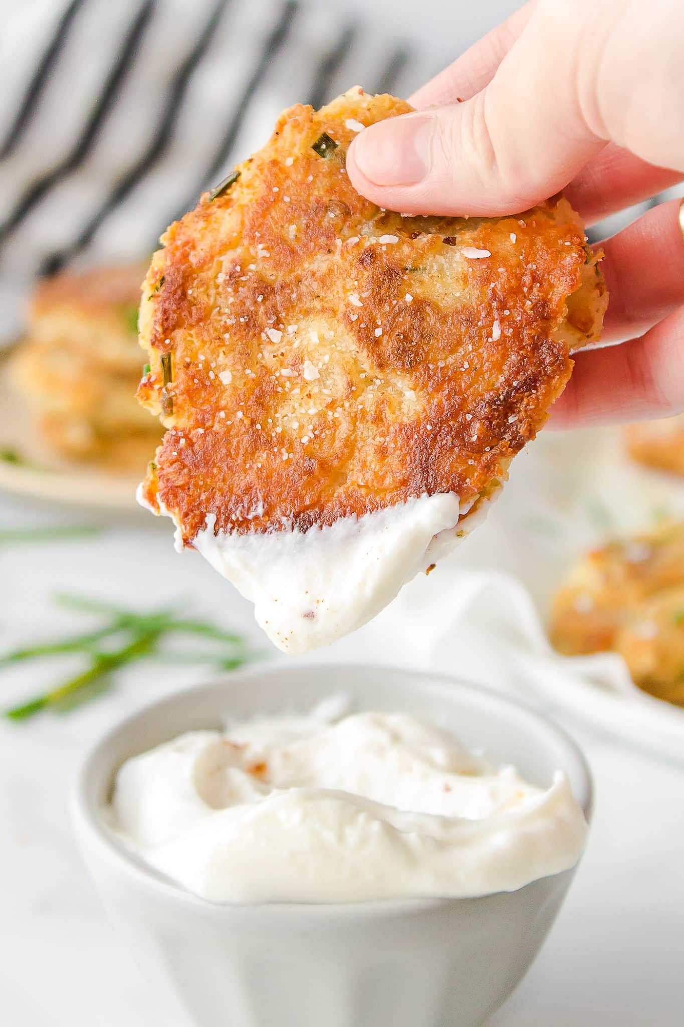 potato fritter dipped into creamy dip.