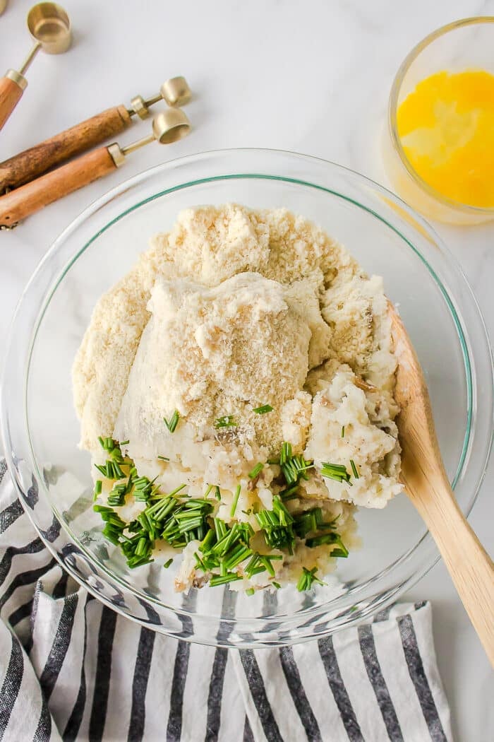 ingredients for mashed potato fritters in bowl.