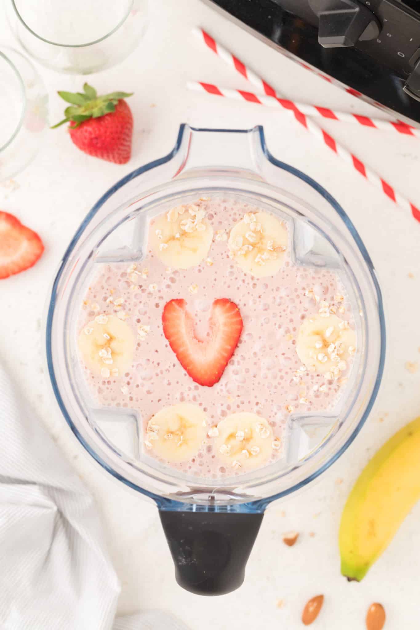 pink smoothie inside of a blender