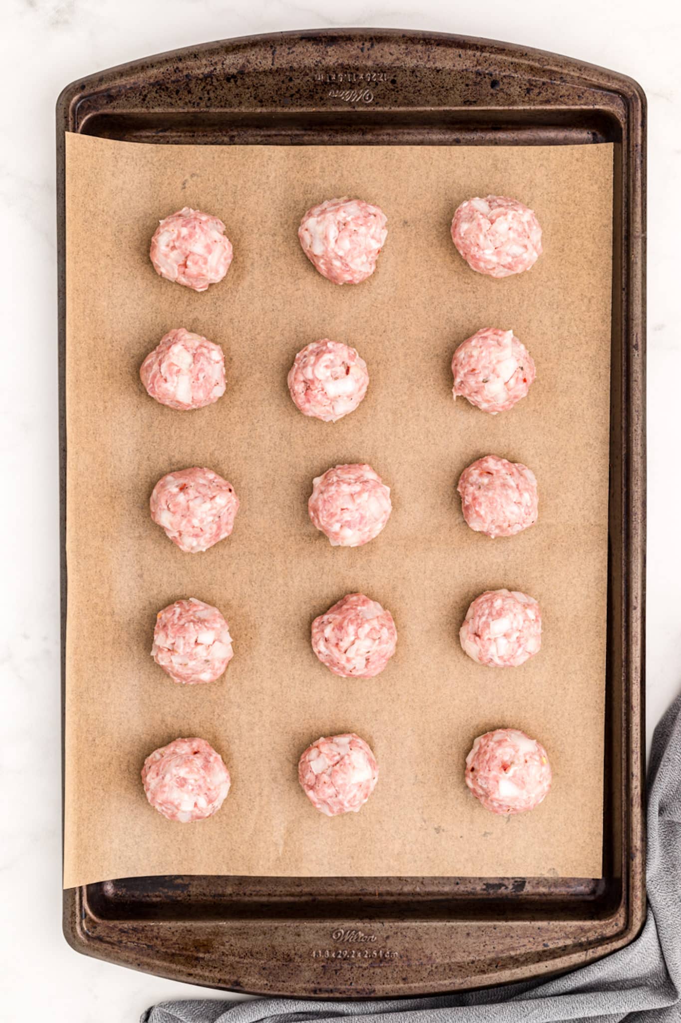 meatballs on a baking pan ready to be baked