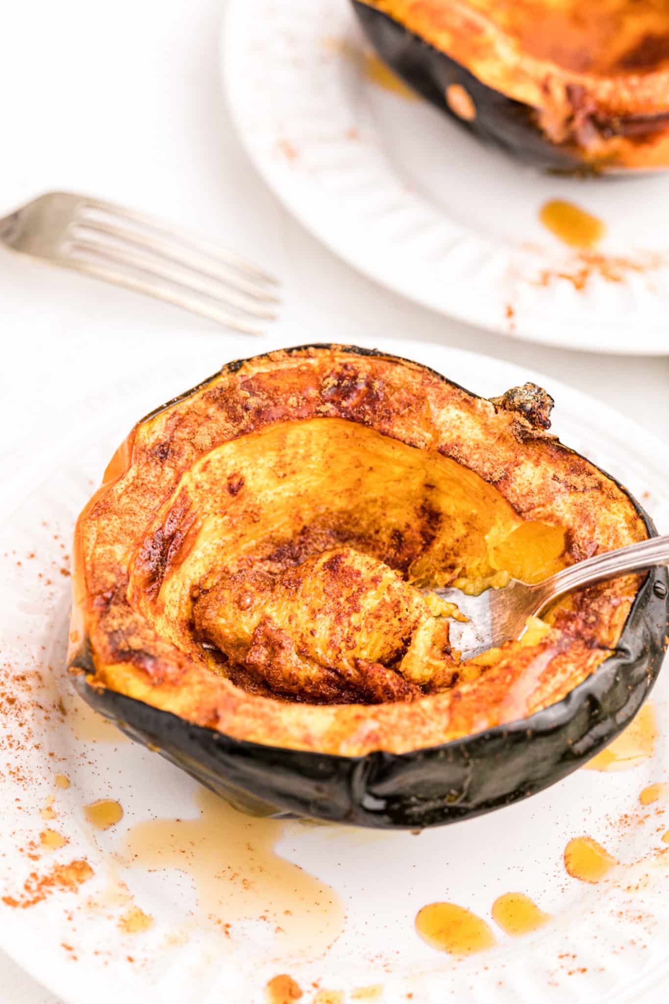 roasted acorn squash on a plate.