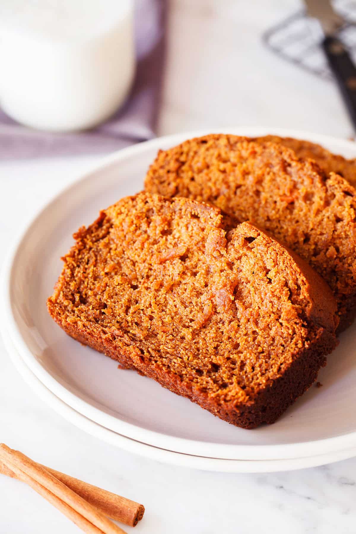 two slices of gluten-free sweet potato bread on a plate.