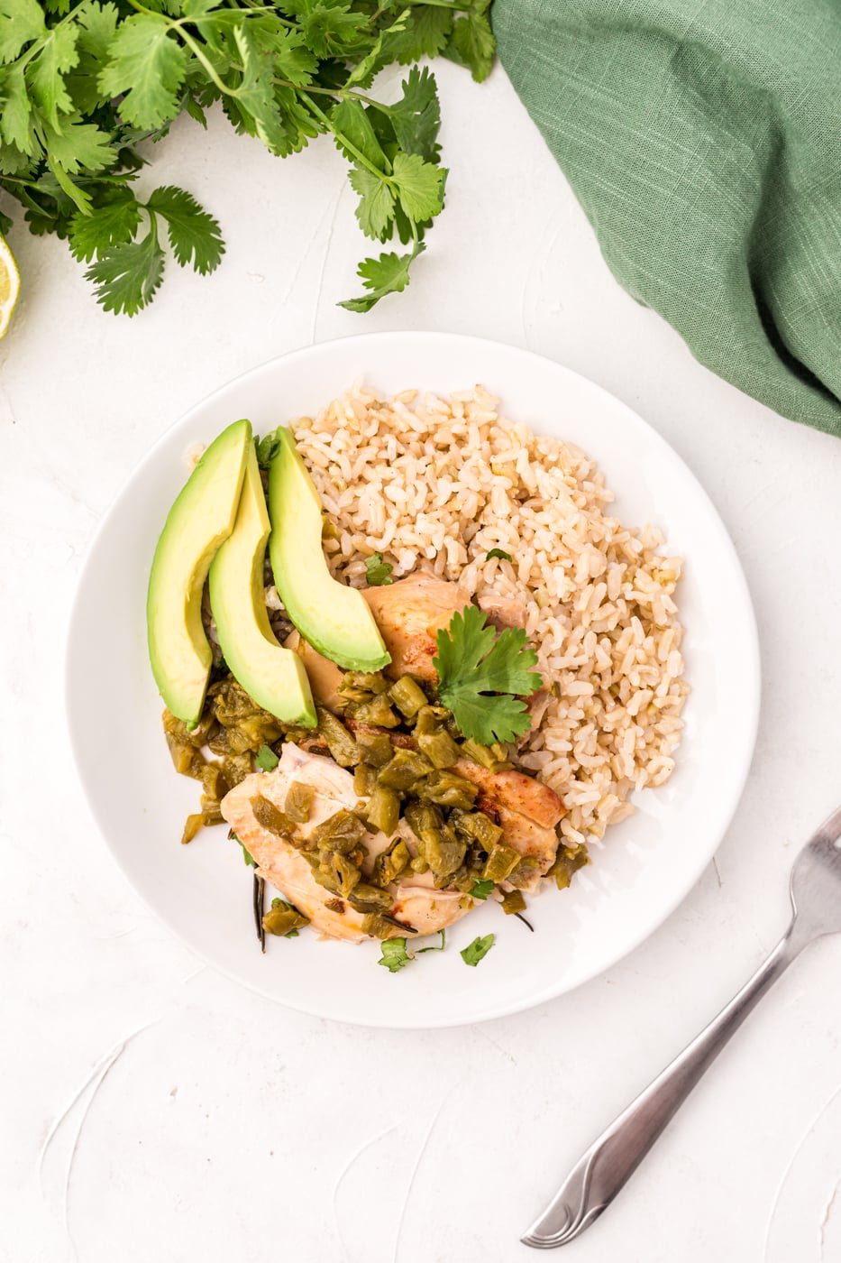 overhead photo of chicken served with rice and avocado.