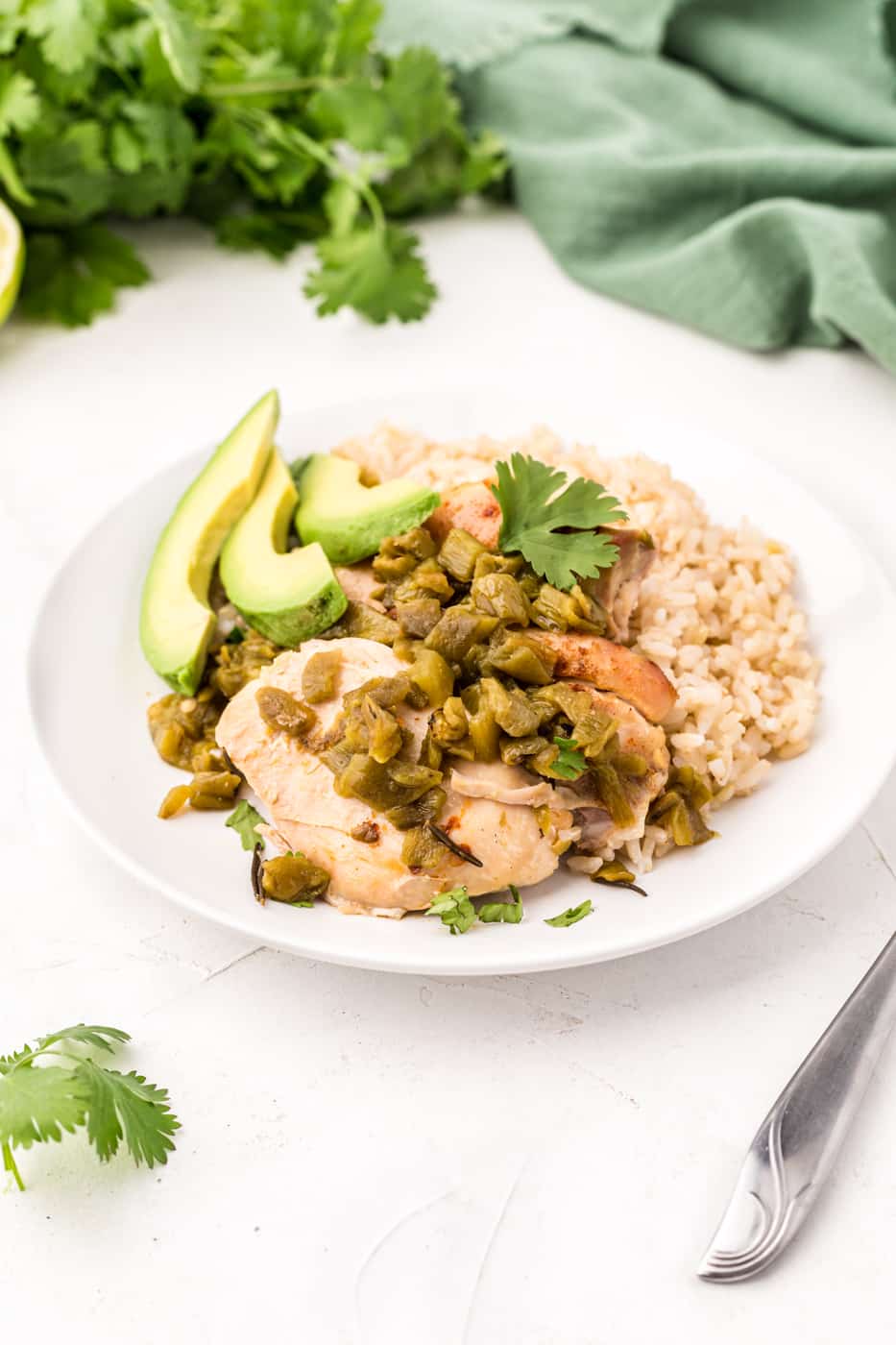 crockpot chicken thighs with green chiles on table