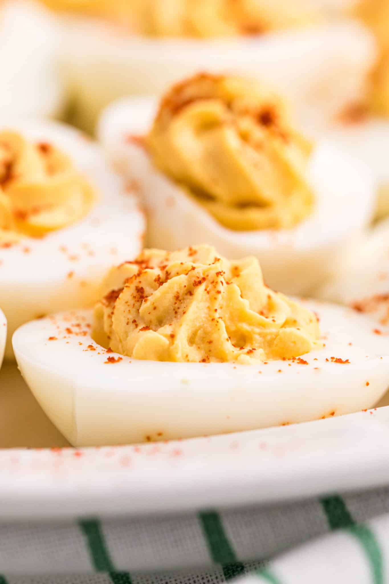 close up of a keto deviled egg with smoked paprika on top.