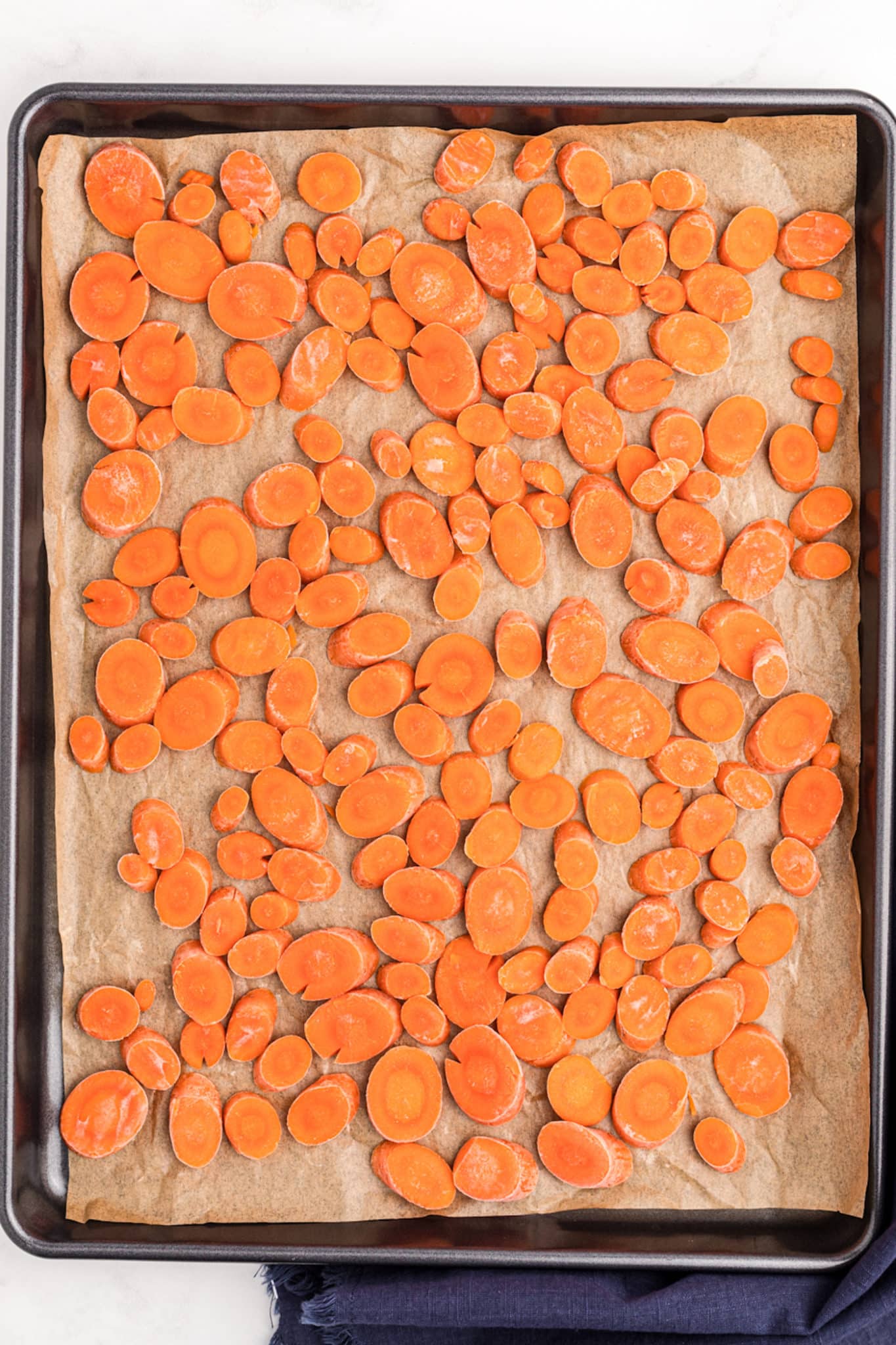 frozen carrots on a sheet pan