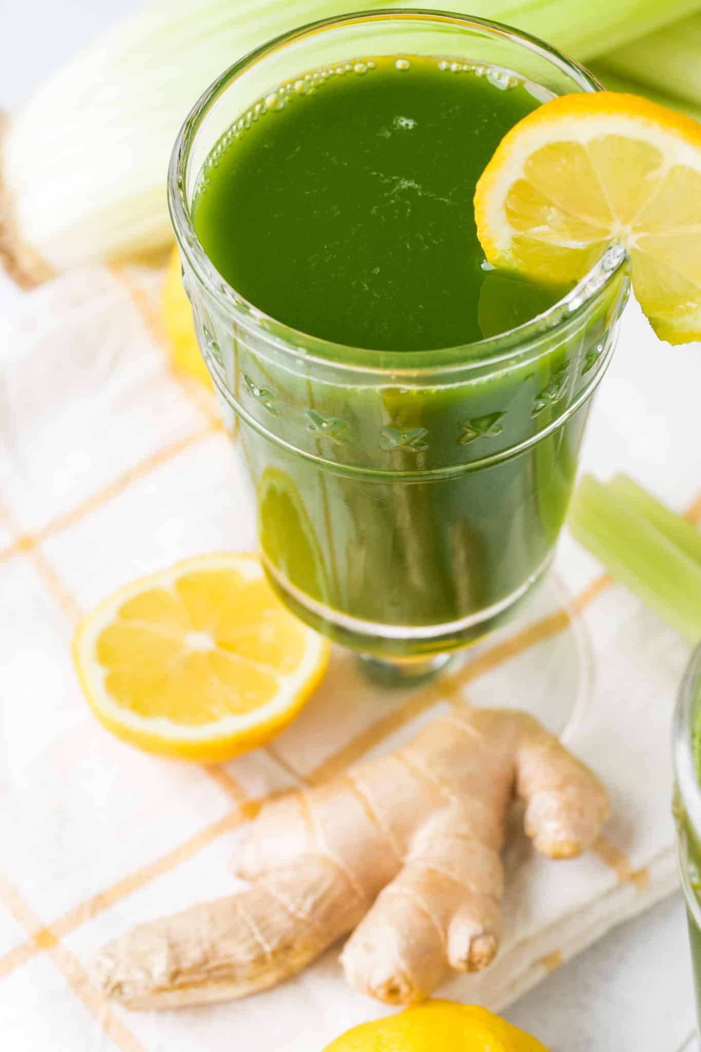 green juice on a table with a lemon slice