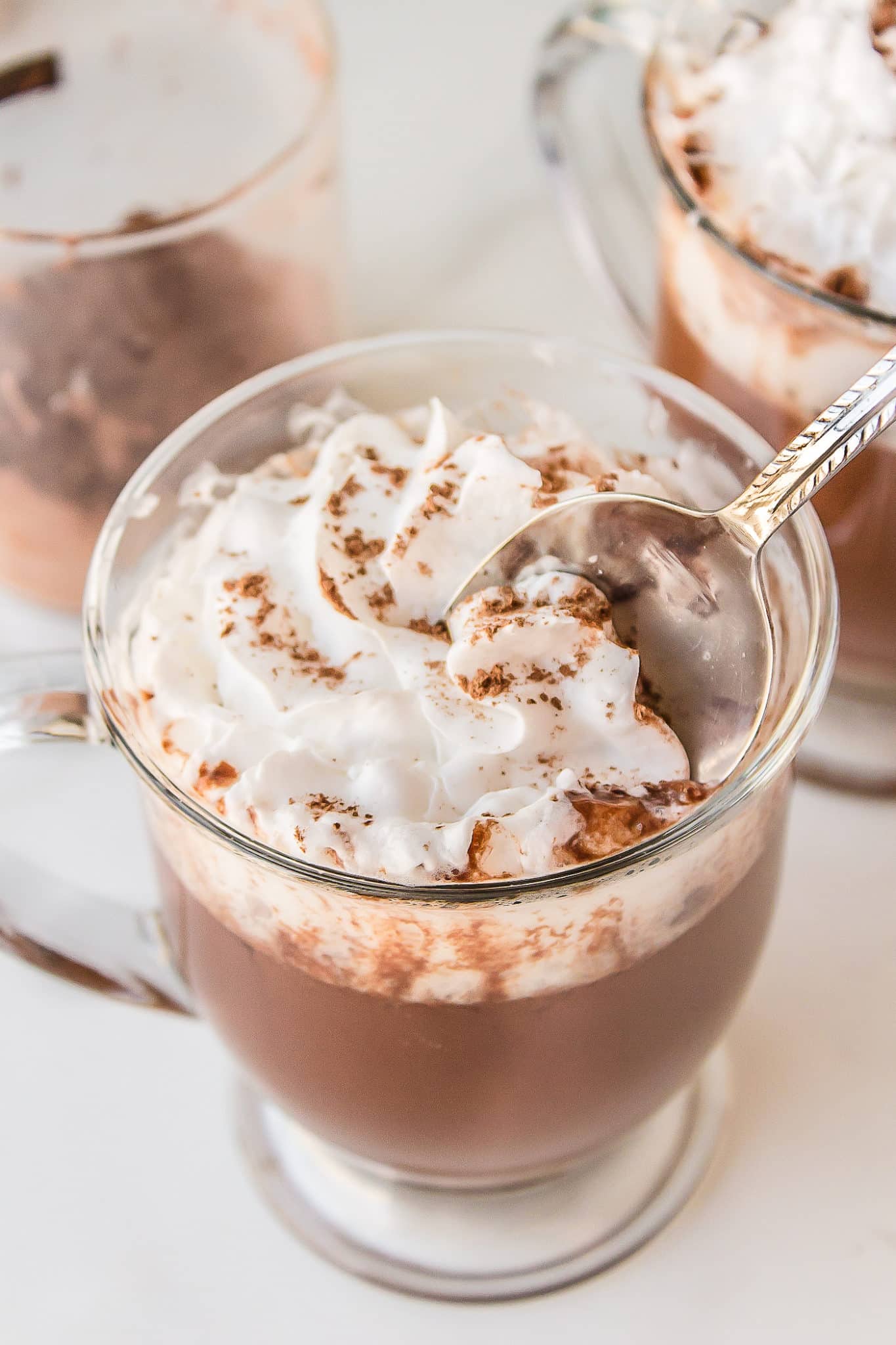 mug of healthy hot chocolate with a spoonful of whipped cream.