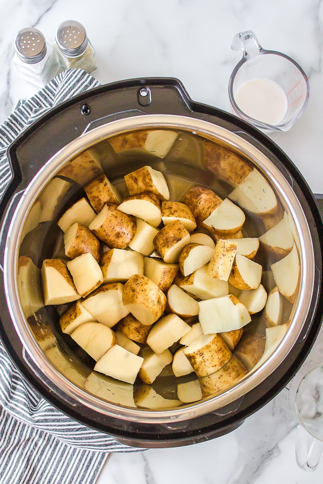 halved white potatoes inside of an instant pot.