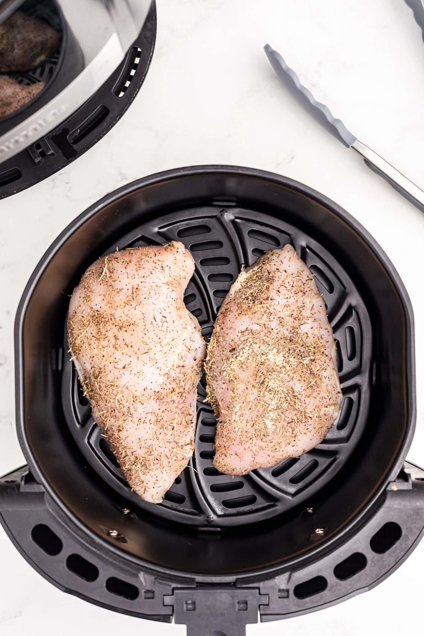 turkey tenderloins in air fryer basket.