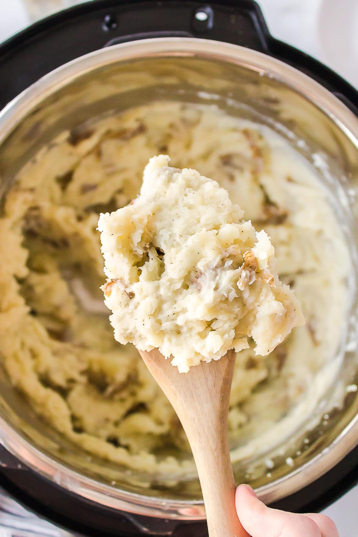 spoonful of mashed potatoes made in the instant pot.