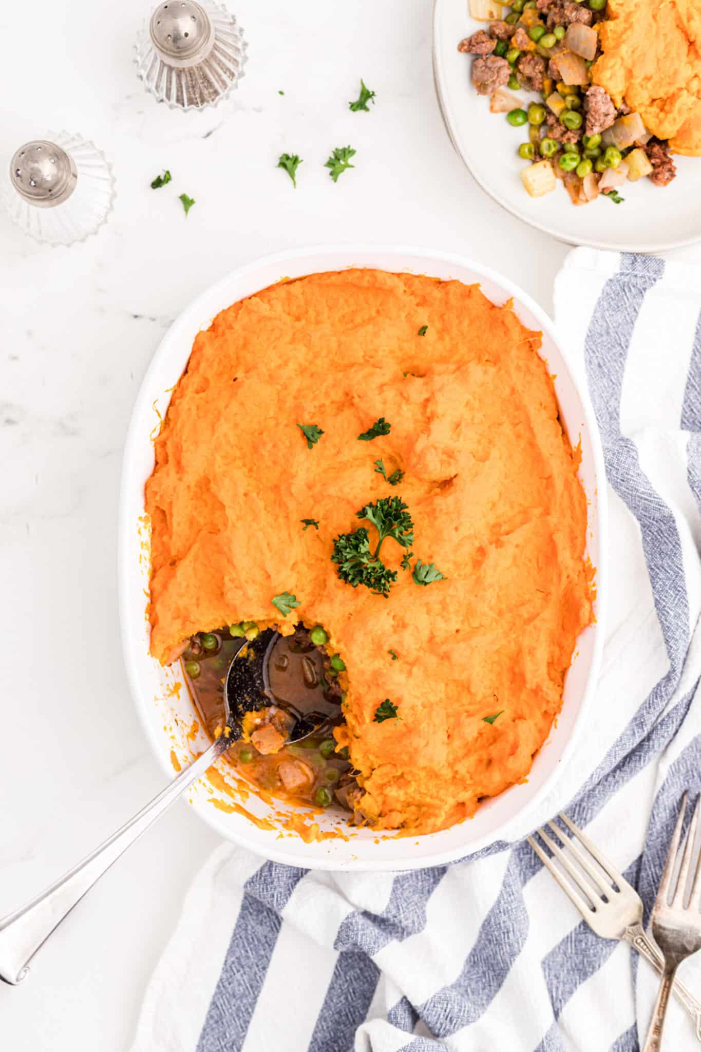 shepherd's pie on table with serving spoon