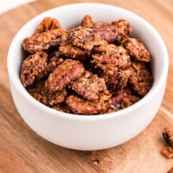 a bowl of candied pecans
