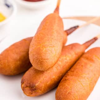 a plate of corn dogs