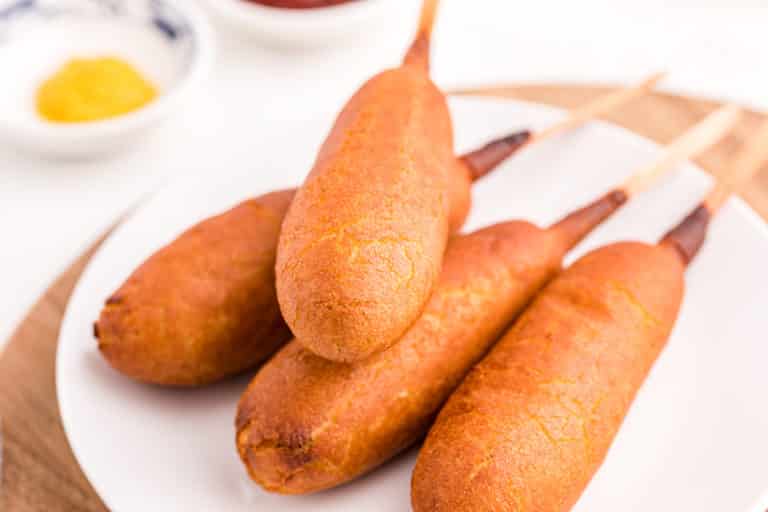 a plate of corn dogs