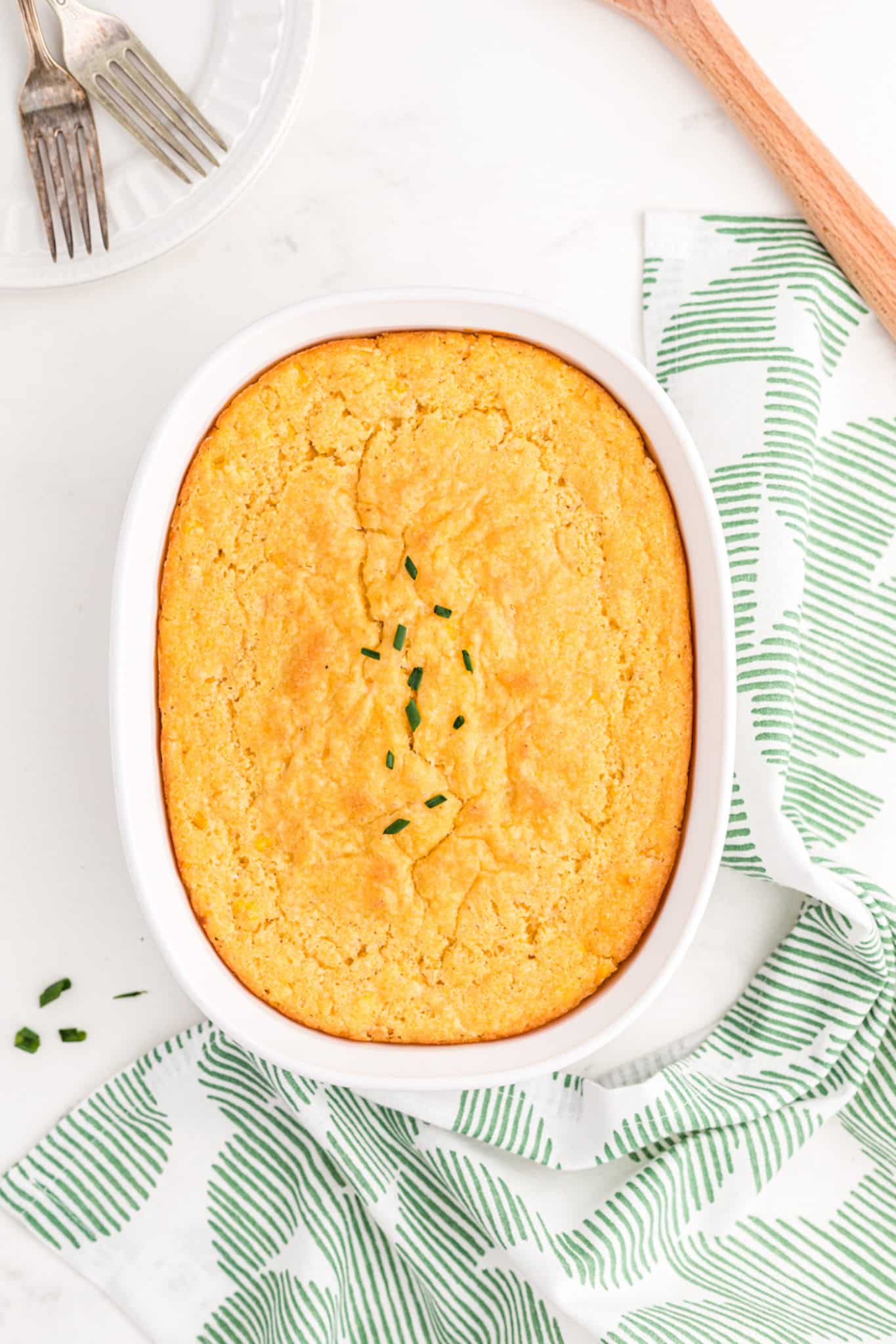 corn casserole in baking dish on table.