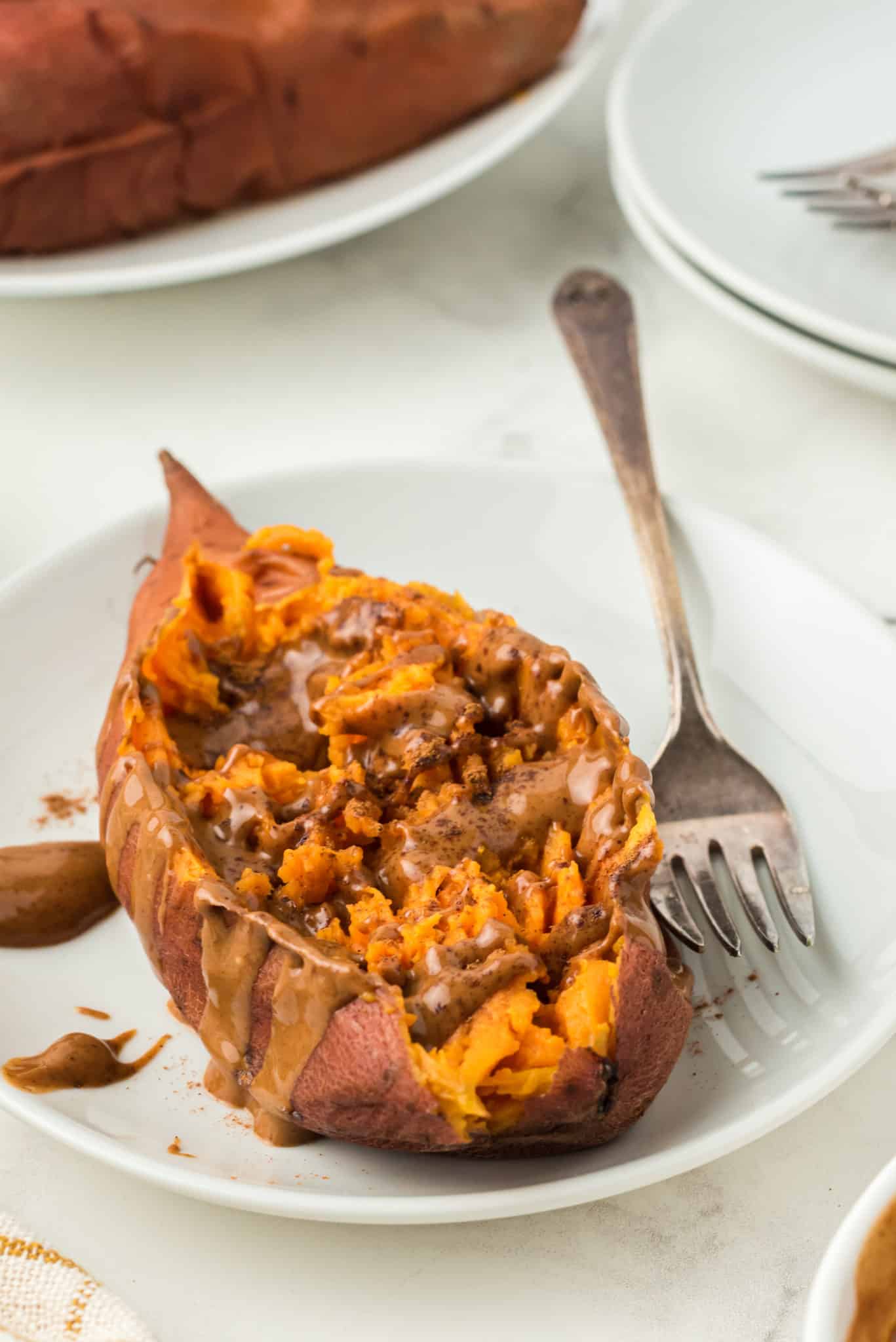 sweet potato topped with almond butter and cinnamon