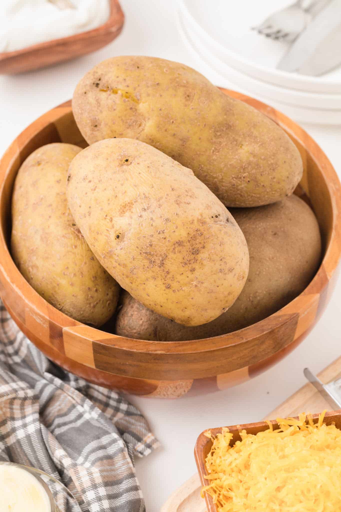 bowl of baked potatoes on a table